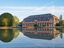 Die Orangerie wurde 1719 nach einem Entwurf von Rmy de la Fosse, dem Erbauer des Schlosses, errichtet. Der Barockbau diente als Winterherberge fr die Orangenbume, die Landgraf Ernst Ludwig von Sardinien hatte kommen lassen. Den Sommer verbrachten die Bume im gepflegten Orangeriegarten. Er wurde 1740 nach Plnen von de la Fosse im Geschmack der typisch franzsischen Barockgrten symmetrisch angelegt. Auch heute noch knnen dort alljhrlich die sdlichen Frchte bewundert werden. Das Gebude beherbergt Tagungs- und Gesellschaftsrume.